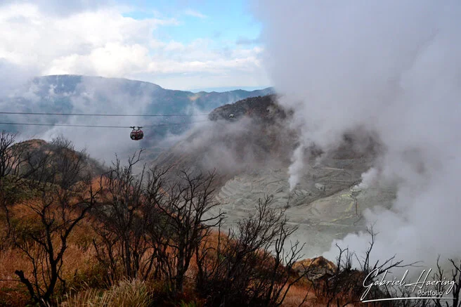 Volcanic steam rising from the sulfur vents of Ōwakudani seen from the Hakone Ropeway