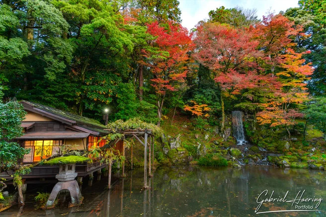 Autumn foliage in Kenrokuen Garden with maple trees in yellow, orange, and red
