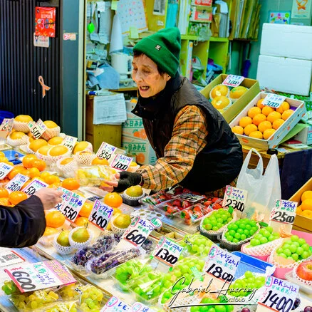 Crowded Ōmichō Market in Kanazawa during lunchtime with food stalls and visitors