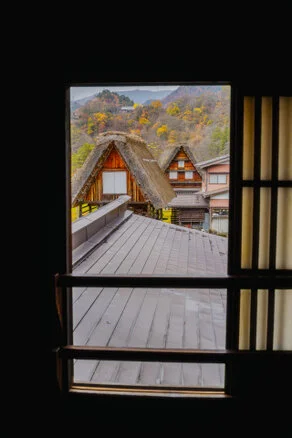 Panorama of Shirakawa-Go village and valley forest in autumn foliage